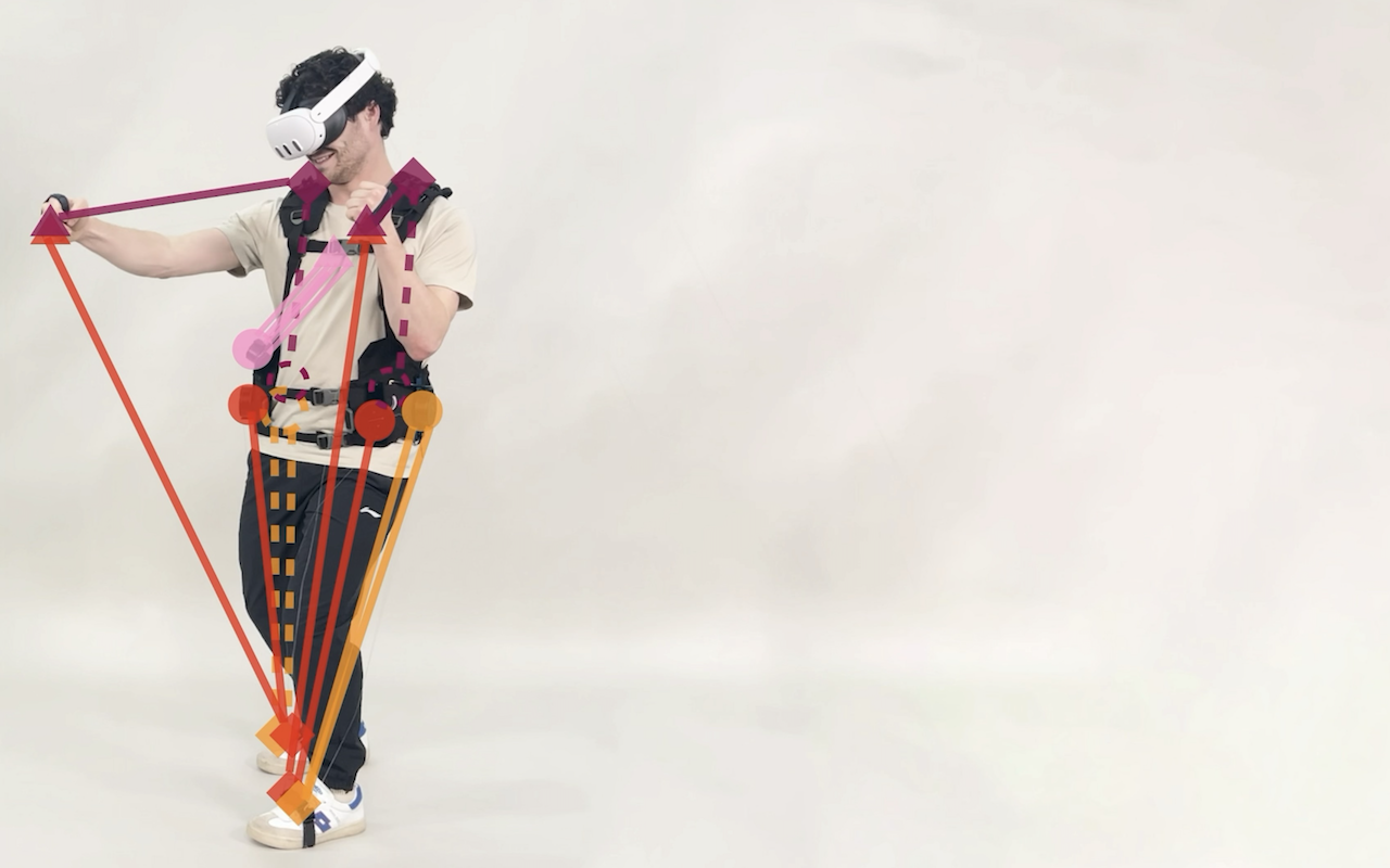 Photo of the Kinethreads prototype, showing a full-body haptic exosuit with visible motor-pulley mechanisms.